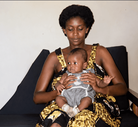 Deogratius Ndejembi akiwa na mama yake, Amina.